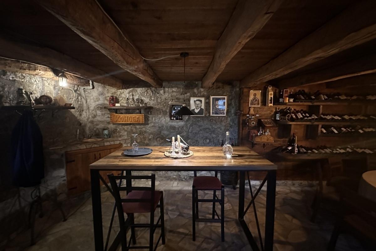 Traditional Montenegrin interior of Konoba Stanišić with rustic wooden design