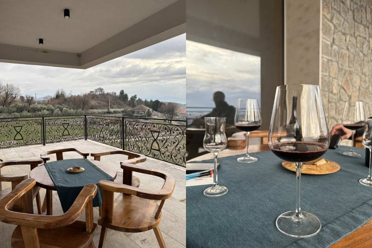 Elegant wine tasting setup with vineyard view at I Wine Ivanović